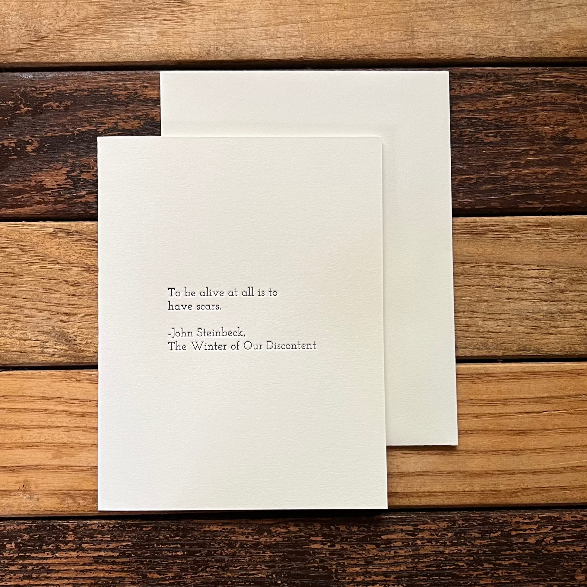 Greeting card with text on a wooden surface