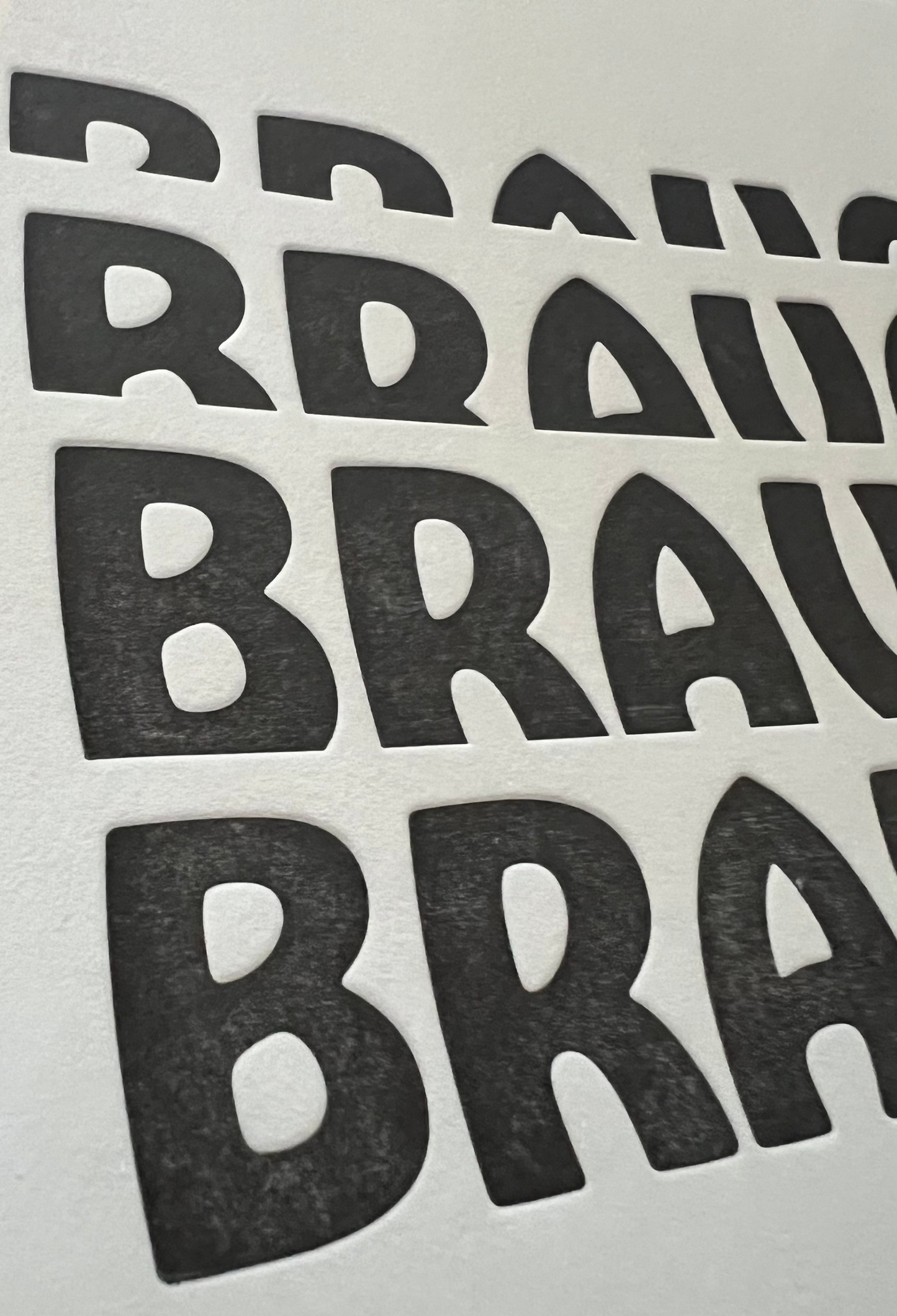 Multiple 'BRAVO' stickers arranged in a grid on a light gray background