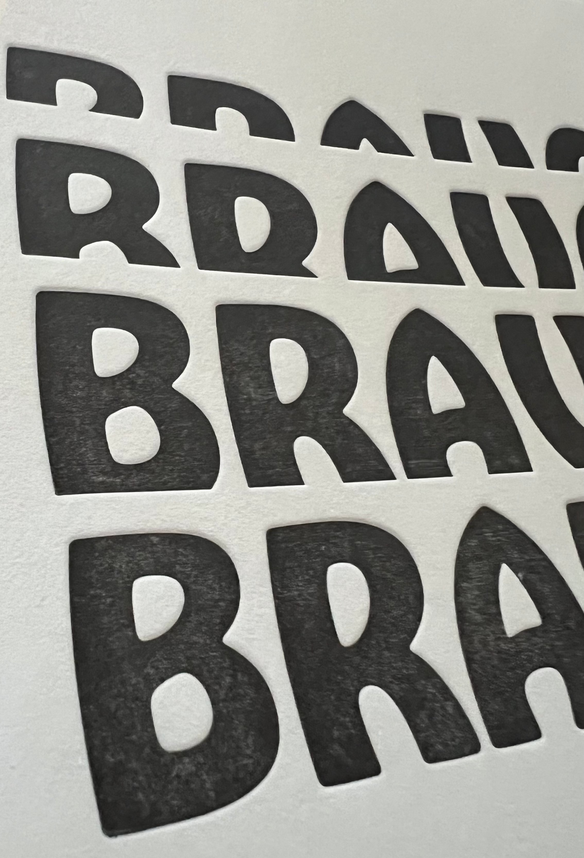 Multiple 'BRAVO' stickers arranged in a grid on a light gray background