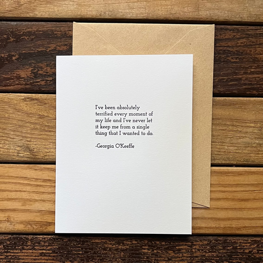 White card with text on a wooden surface